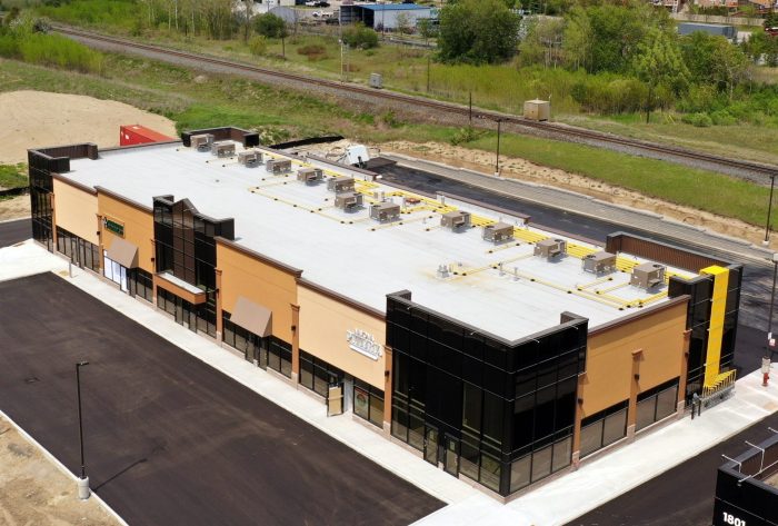 Preparing Flat Industrial Roofs For Winter At Commercial Buildings